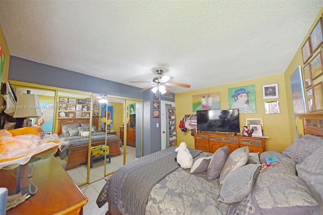 tiled bedroom featuring a textured ceiling and ceiling fan