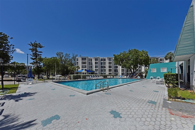 17560 Atlantic Blvd Unit 118, Sunny Isles Beach, FL 33160 - community pool featuring a patio area and fence