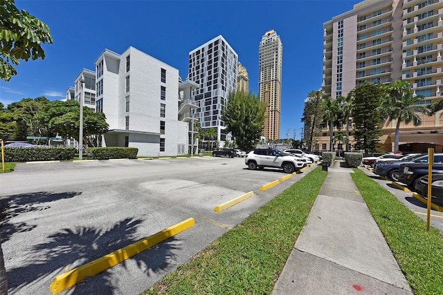 17560 Atlantic Blvd Unit 118, Sunny Isles Beach, FL 33160 - view of building exterior with uncovered parking