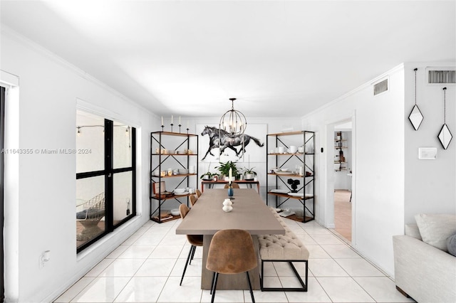 dining room with light tile patterned floors, an inviting chandelier, and ornamental molding