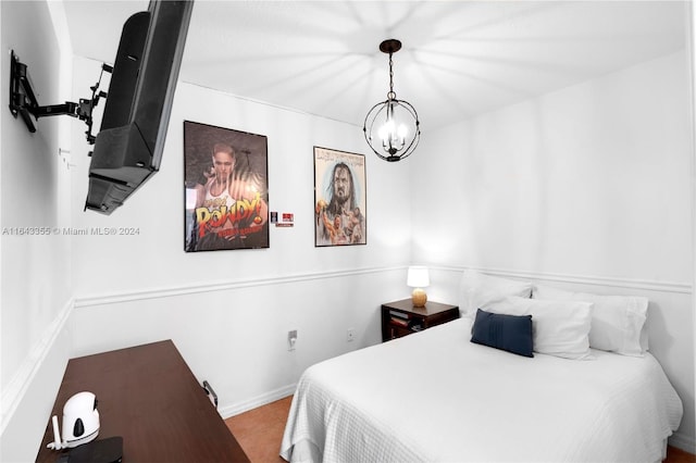 bedroom with an inviting chandelier