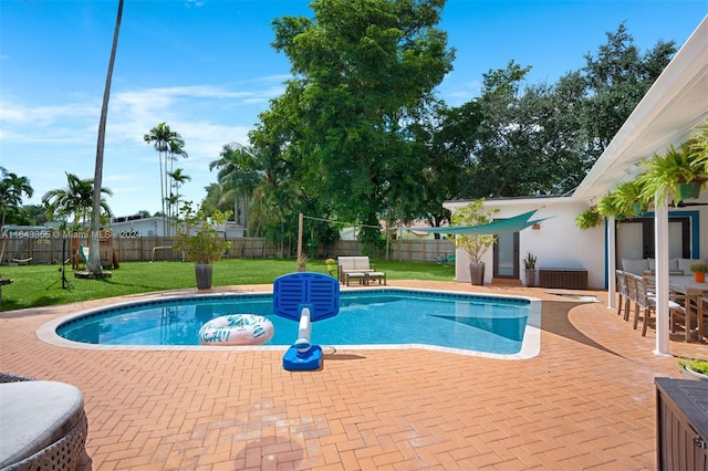 view of pool featuring a yard and a patio area