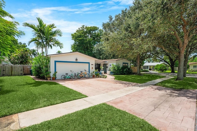 single story home with a front yard and a garage