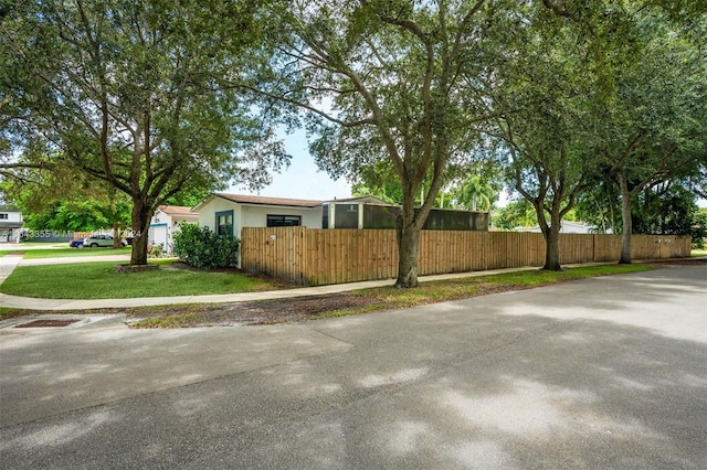 view of side of property featuring a yard