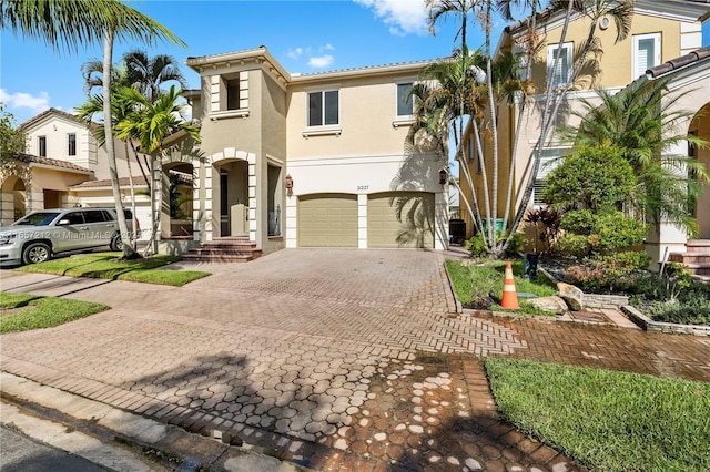 mediterranean / spanish home featuring a garage