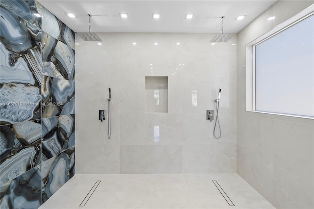 bathroom with tiled shower