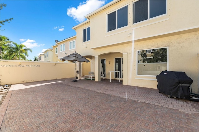 back of house with a patio