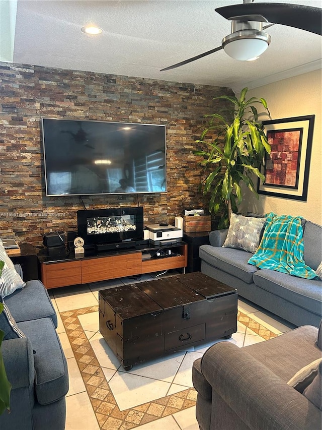 living room with a textured ceiling and light tile patterned floors