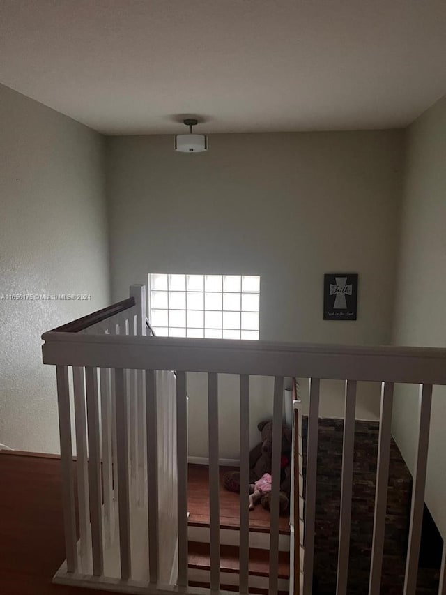 staircase with wood-type flooring