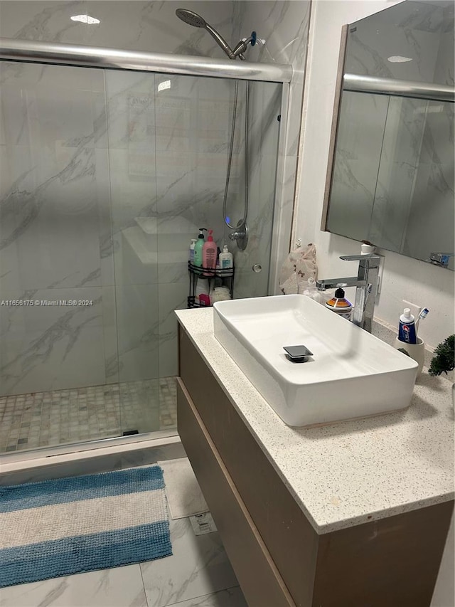 bathroom with vanity and an enclosed shower