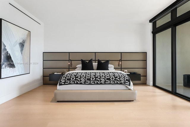 bedroom with light wood-type flooring