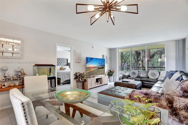 living room featuring an inviting chandelier and light tile patterned flooring