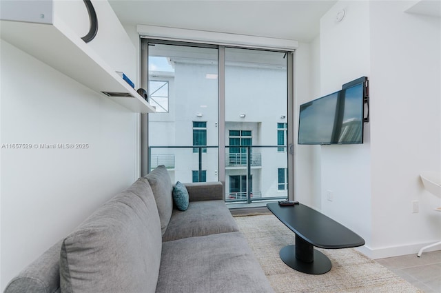 living room featuring a wall of windows