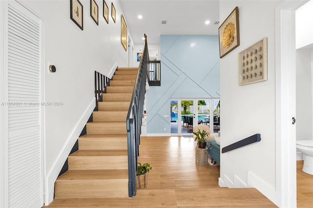 staircase featuring hardwood / wood-style floors