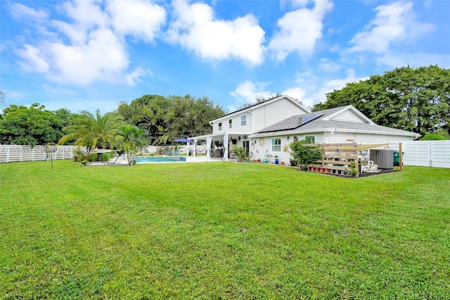 view of yard with a fenced in pool, a patio area, and cooling unit