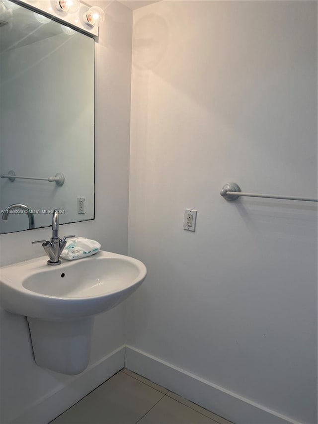 bathroom featuring tile patterned flooring and sink