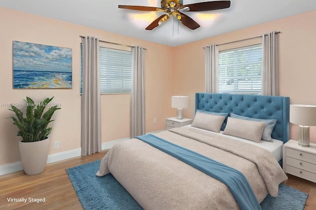 bedroom featuring ceiling fan and light hardwood / wood-style flooring