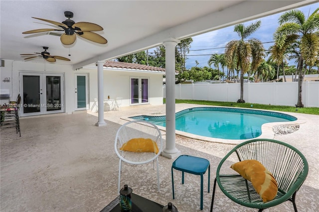 view of pool with a patio area, french doors, and ceiling fan