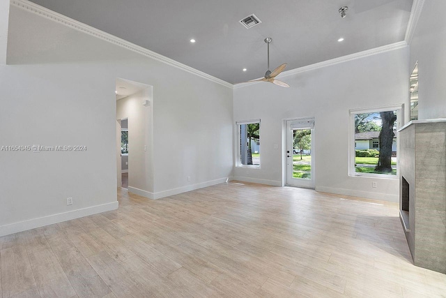 unfurnished living room featuring crown molding, ceiling fan, and light hardwood / wood-style floors