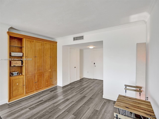 interior space featuring crown molding and dark hardwood / wood-style flooring