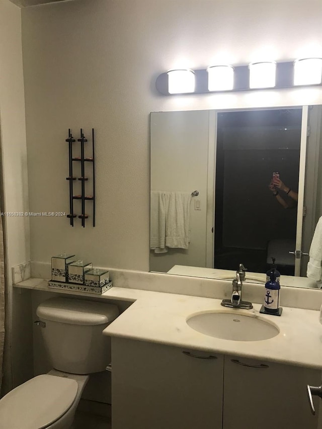 bathroom with vanity and toilet