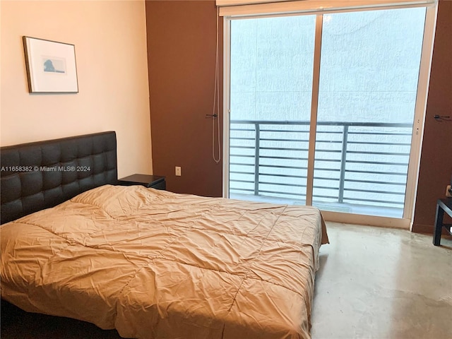 bedroom featuring concrete floors