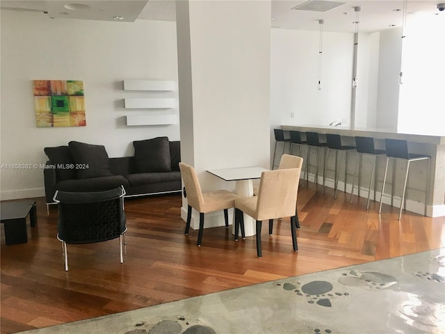 dining space featuring wood-type flooring