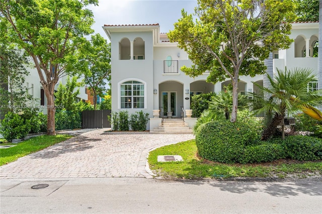 mediterranean / spanish-style home featuring a balcony