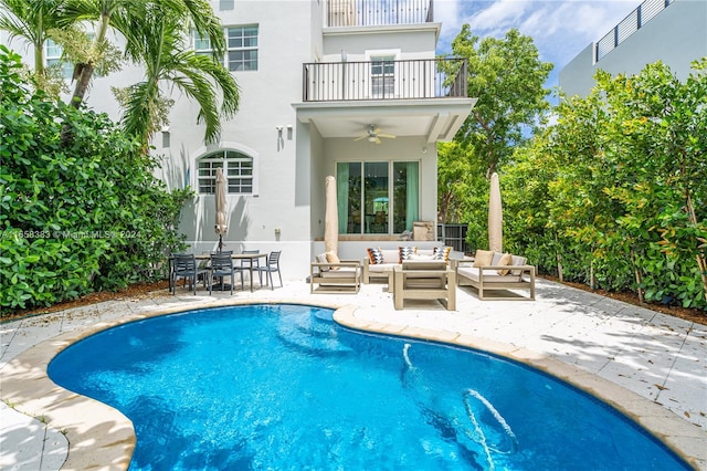 view of pool featuring ceiling fan, an outdoor hangout area, and a patio area