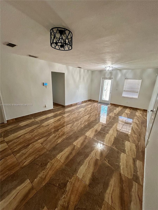 interior space with a textured ceiling