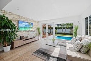 interior space featuring wood finished floors and french doors