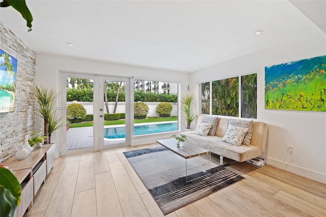 unfurnished sunroom featuring french doors