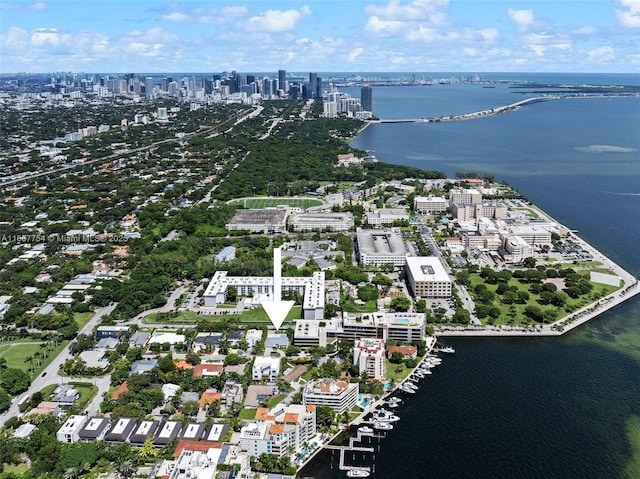 drone / aerial view with a city view and a water view