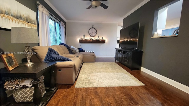 living room featuring ornamental molding, ceiling fan, and dark hardwood / wood-style floors