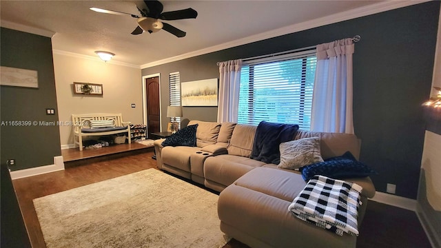 living room with crown molding, ceiling fan, and hardwood / wood-style flooring