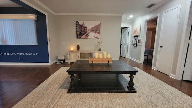 dining room with ornamental molding and dark wood-type flooring