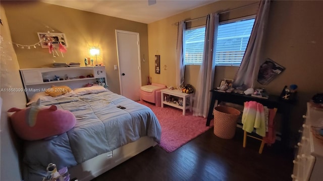 bedroom featuring ceiling fan and dark hardwood / wood-style floors