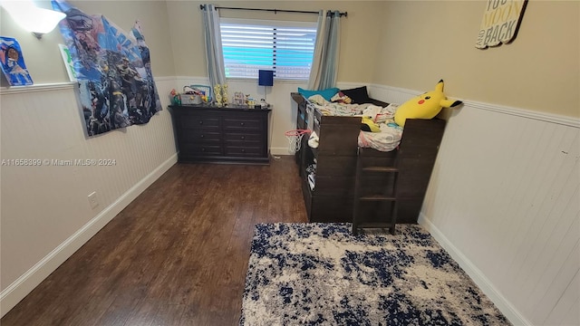 bedroom featuring dark wood-type flooring