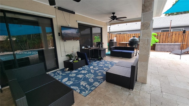 view of patio featuring an outdoor hangout area and ceiling fan