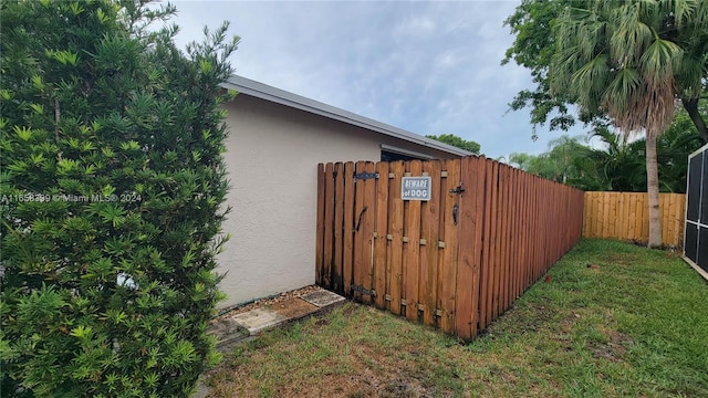 view of side of home featuring a lawn