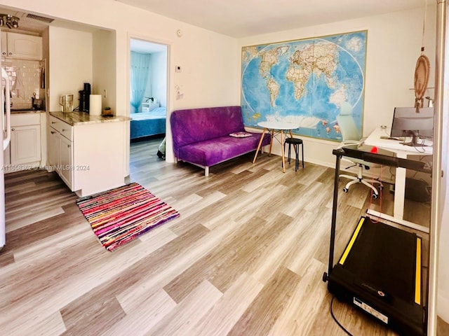 sitting room with light hardwood / wood-style floors