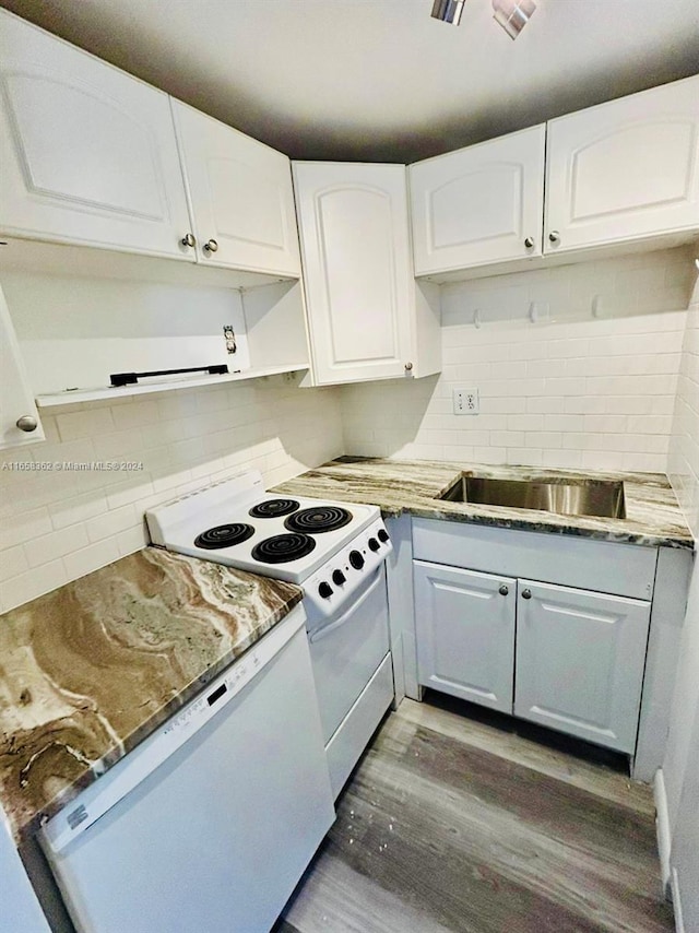 kitchen featuring decorative backsplash, white appliances, dark hardwood / wood-style floors, and white cabinets