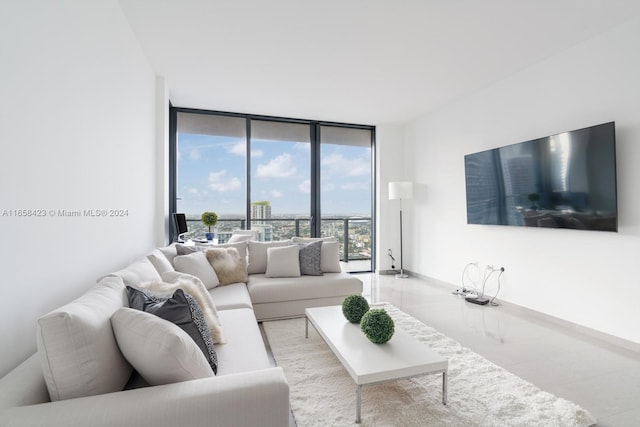 living room featuring floor to ceiling windows