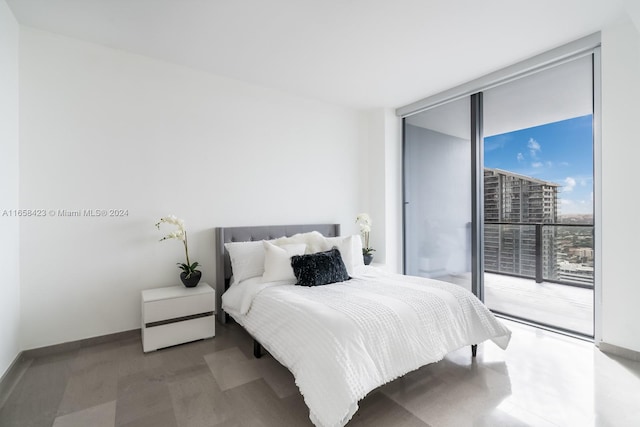 bedroom featuring floor to ceiling windows and access to outside