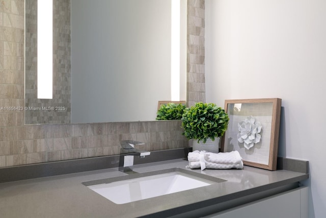 68 SE 6th St Unit 3706, Miami, FL 33131 - bathroom with vanity and tasteful backsplash