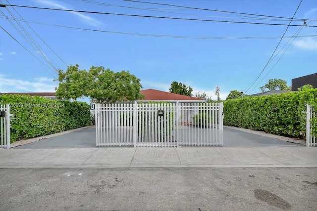 view of gate featuring fence