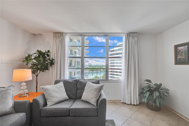 tiled living room with a water view