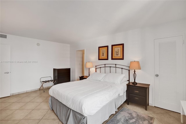 bedroom with light tile patterned flooring