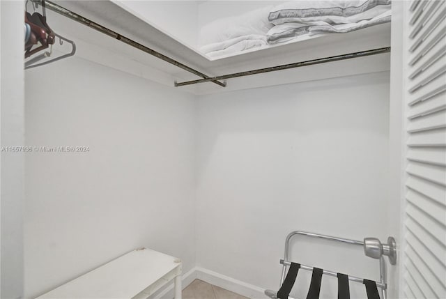 walk in closet featuring light tile patterned floors