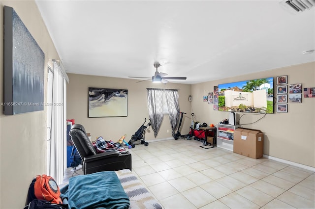 interior space featuring ceiling fan and light tile patterned floors